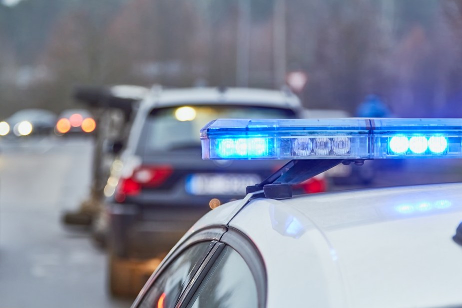 Blue lights on top of a police cruiser.