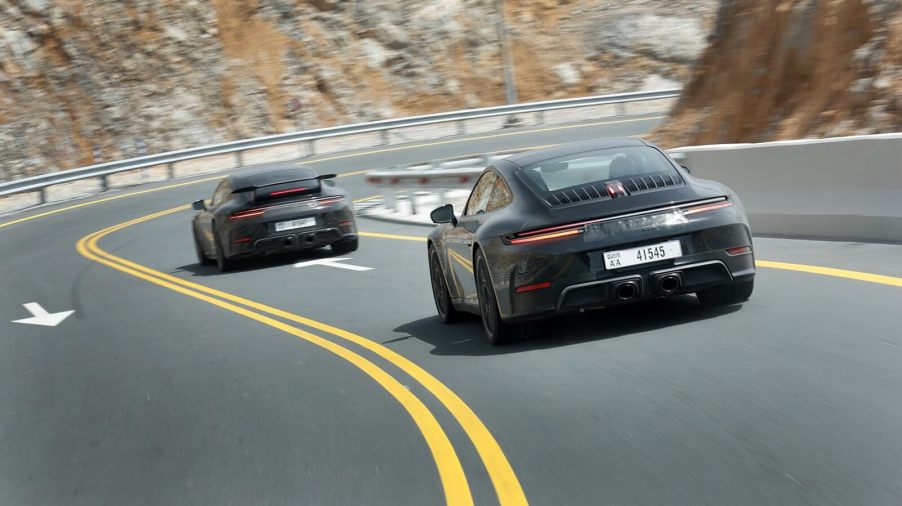 A set of Porsche 911 Hybrid prototypes on on the road.