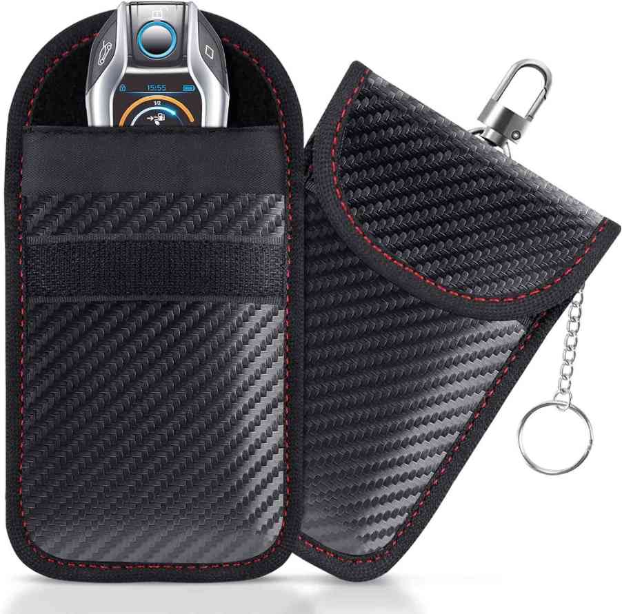 Car key fob inside a black RFID-blocking security pouch.