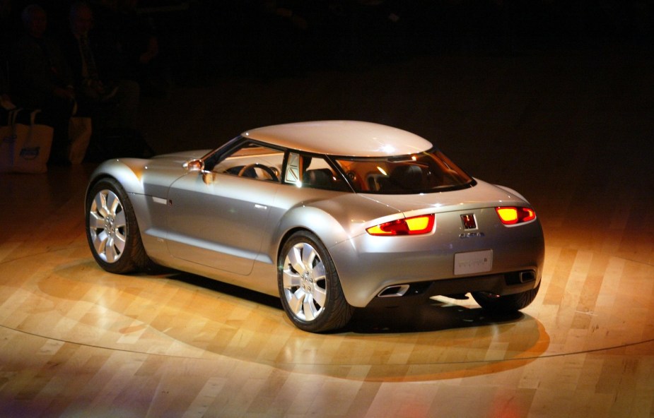 Gary Saturn Curve concept car parked on a wooden stage.