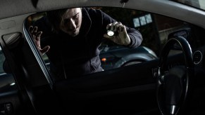 Owner looking in the window of a recovered, stolen car.