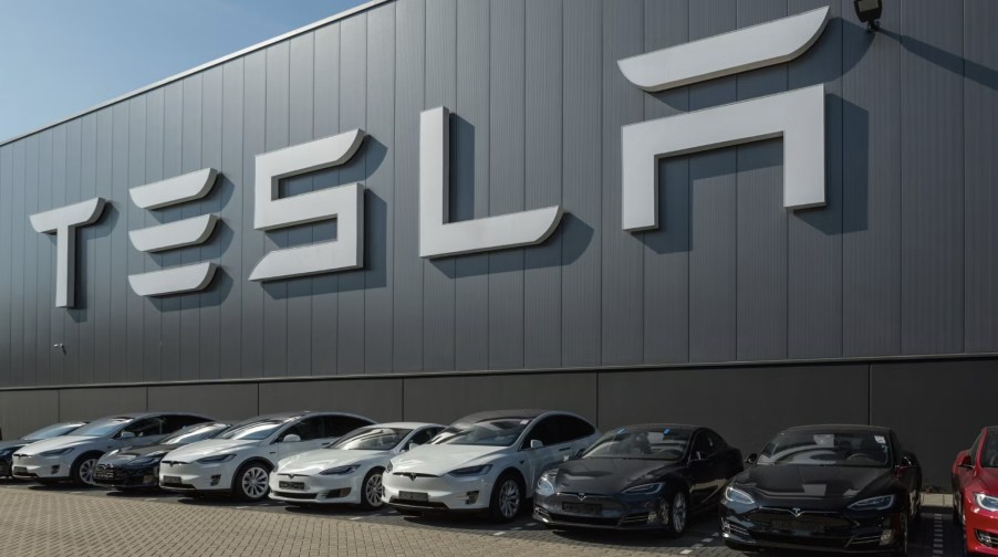 Tesla models parked outside a Tesla building