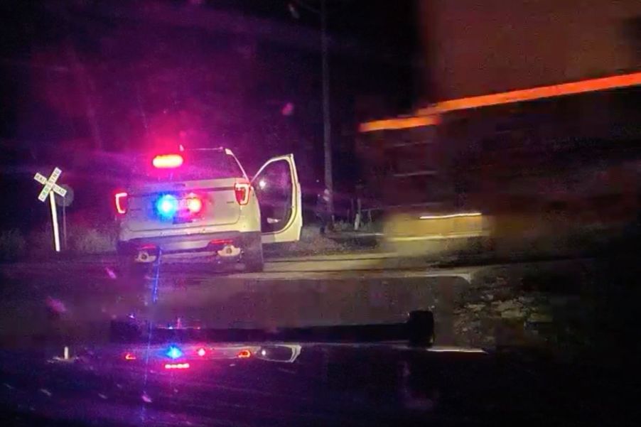 A train hitting a cop car