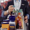 A flight attendant pushing a beverage cart