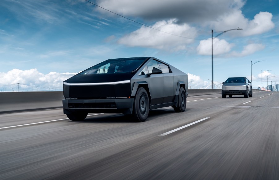 Tesla Cybertruck drives in front of another Cybertruck on a freeway