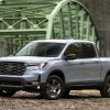 The 2024 Honda Ridgeline parked near a bridge