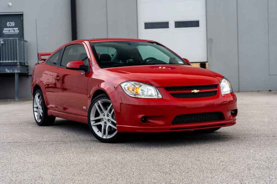 A red 2009 Chevrolet Cobalt SS Turbo parked in right front angle view with front wheel turned in, it's one of Reddit's "forgotten but most fun cars."