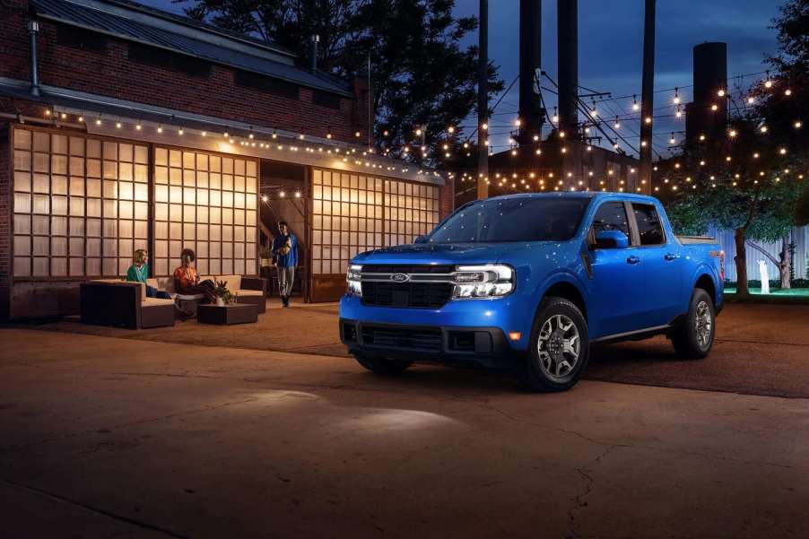 The 2023 Ford Maverick Hybrid parked near a home