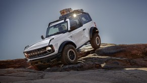 The 2024 Ford Bronco crawling over rocks