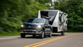 The 2024 Ford F-150 Hybrid towing a camper