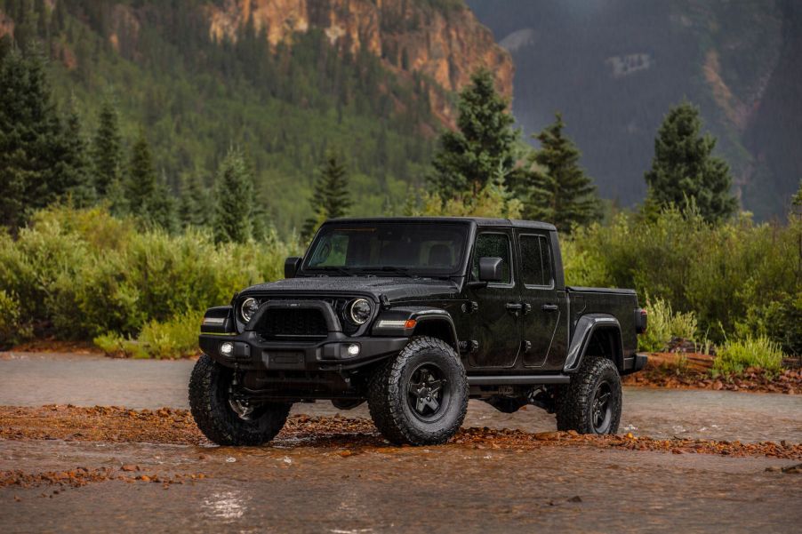 The 2024 Jeep Gladiator off-roading in the woods