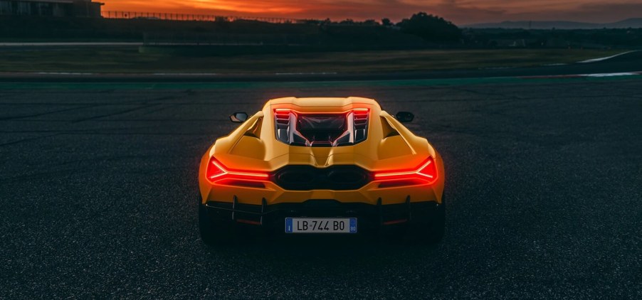 A bright-yellow 2024 Lamborghini Revuelto shows off its rear end styling without BAR mode.