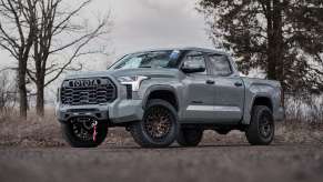 The 2024 Toyota Tundra off-roading near trees