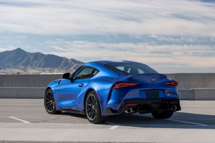 A blue 2025 Toyota GR Supra 3.0 on a parking structure roof.