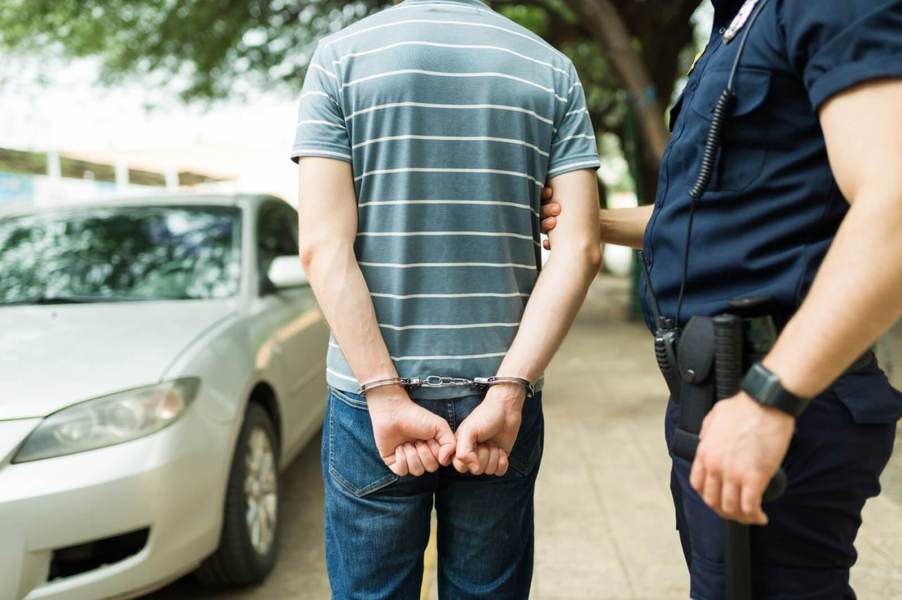 A driver gets arrested at a traffic stop.