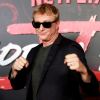 Cobra Kai star William Zabka steps out of his Dodge Challenger and onto the red carpet at a Netflix event.