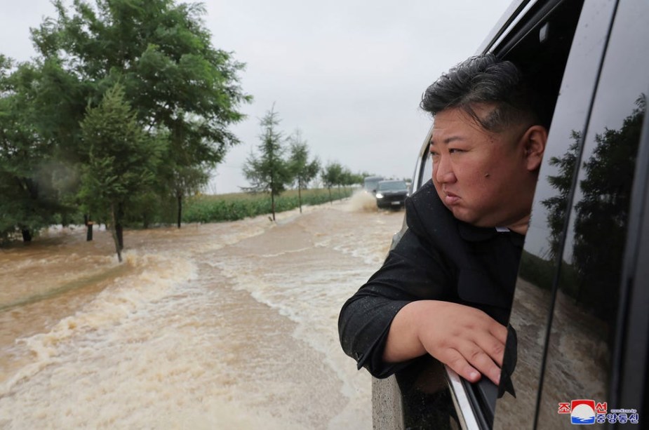 Kim Jung Un hanging out the window of his Lexus LX 600