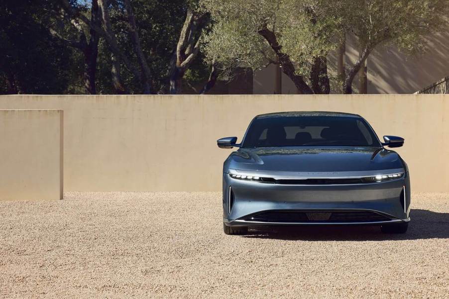 A Lucid Air Pure, the most efficient car in the world, parks on gravel.