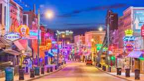 The Blues clubs lining Beale Street in Memphis, Tennessee at twilight.