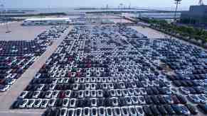 Parking lot full of white Tesla cars