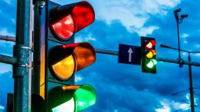 Traffic lights in front of a dark sky