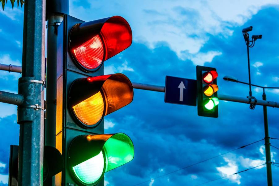 Traffic lights in front of a dark sky