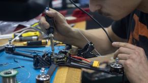 Ukrainian man hand-builds an explosive quadricopter military drone