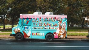 An ice cream truck parked in left profile view