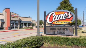 Raising Cane's exterior, a teenage driver was stopped after speeding 118 mph on the way to Cane's