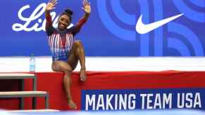 Simone Biles waves to crowd at the 2024 U.S. Olympic Gymnastics Team Trials