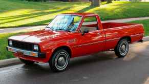 A red 1982 Dodge Ram 50 classic compact truck with pre-facelift headlights