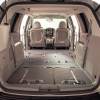 The tan interior of a beige Sedona minivan