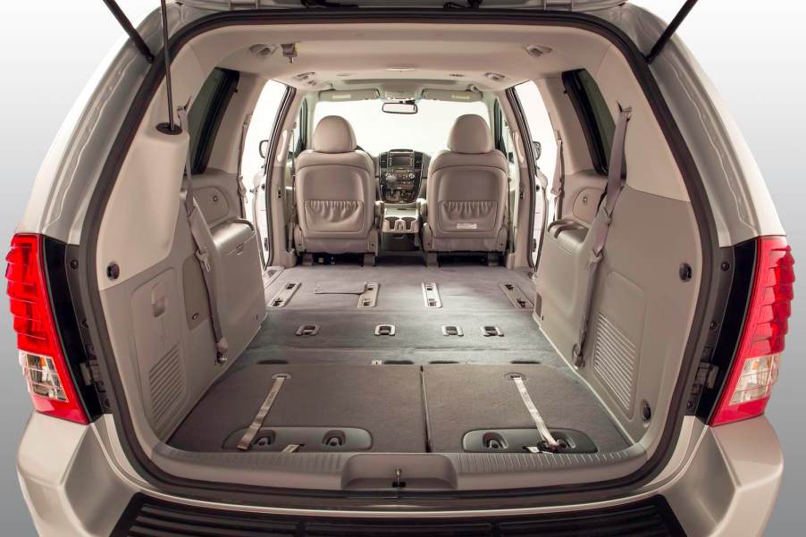 The tan interior of a beige Sedona minivan