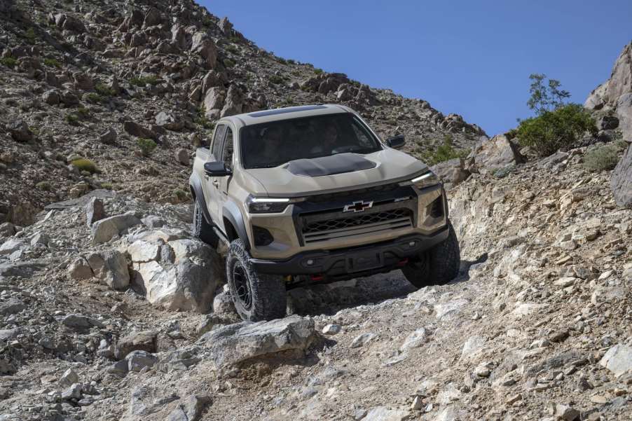 The 2024 Chevy Colorado off-roading over rocky terrain