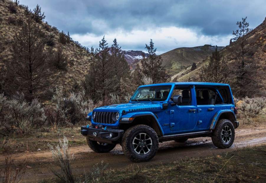 The 2024 Jeep Wrangler 4xe on a muddy path