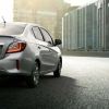 A silver 2024 Mitsubishi Mirage G4 sedan, slated for discontinuation, shows off its rear-end styling.