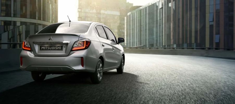 A silver 2024 Mitsubishi Mirage G4 sedan, slated for discontinuation, shows off its rear-end styling.