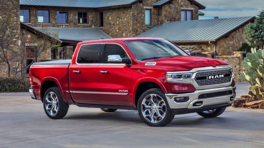 The 2024 Ram 1500 parked near a home