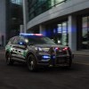 The 2025 Ford Explorer Hybrid police inceptor with its lights on