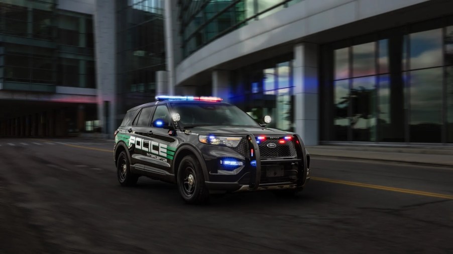 The 2025 Ford Explorer Hybrid police inceptor with its lights on