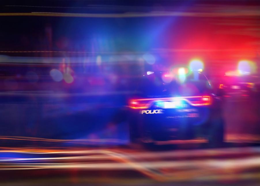 A speeding Dodge Charger police unit prepares to PIT maneuver, or TVI, a suspect vehicle.