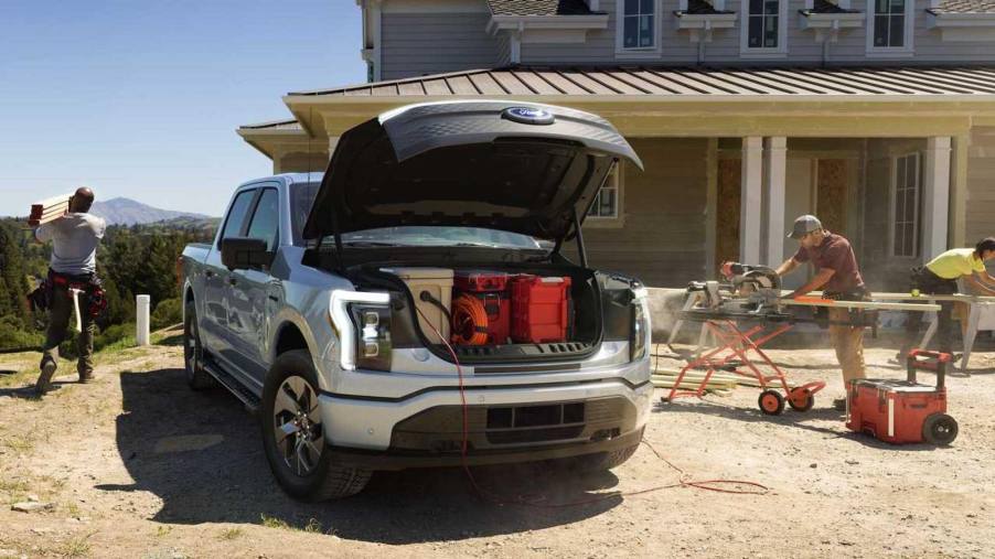 Appliances plugged into a Ford F-150 Lightning on a job site.