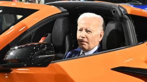 President Joe Biden in a Chevrolet Corvette Z06 at an auto show.