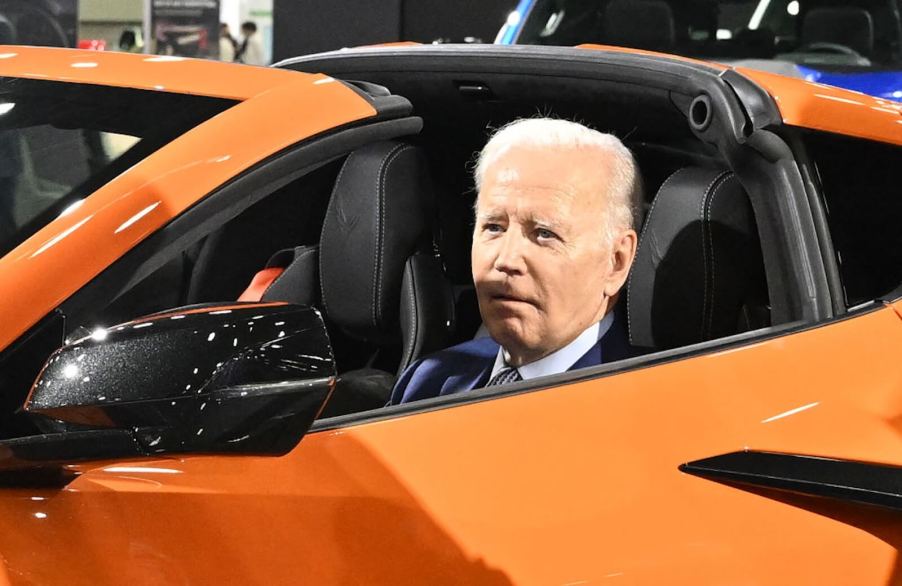 President Joe Biden in a Chevrolet Corvette Z06 at an auto show.