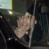 Pete Davidson driving a car at night