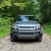 The 2024 Land Rover Defender 130's face in the woods