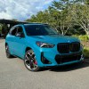 The 2024 BMW X1 M Sport parked near foliage