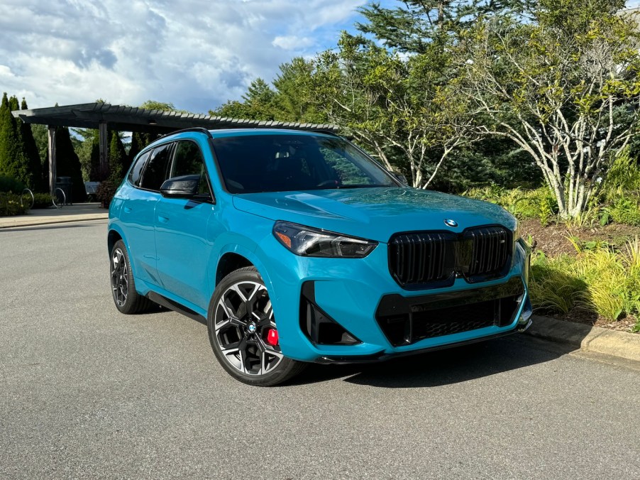 The 2024 BMW X1 M Sport parked near foliage