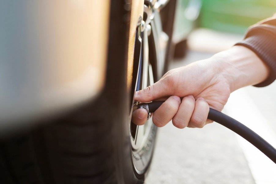 Using an air compressor to inflate tires.