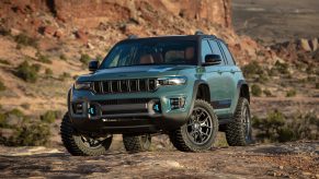 The 2024 Jeep Grand Cherokee 4xe off-roading in dirt